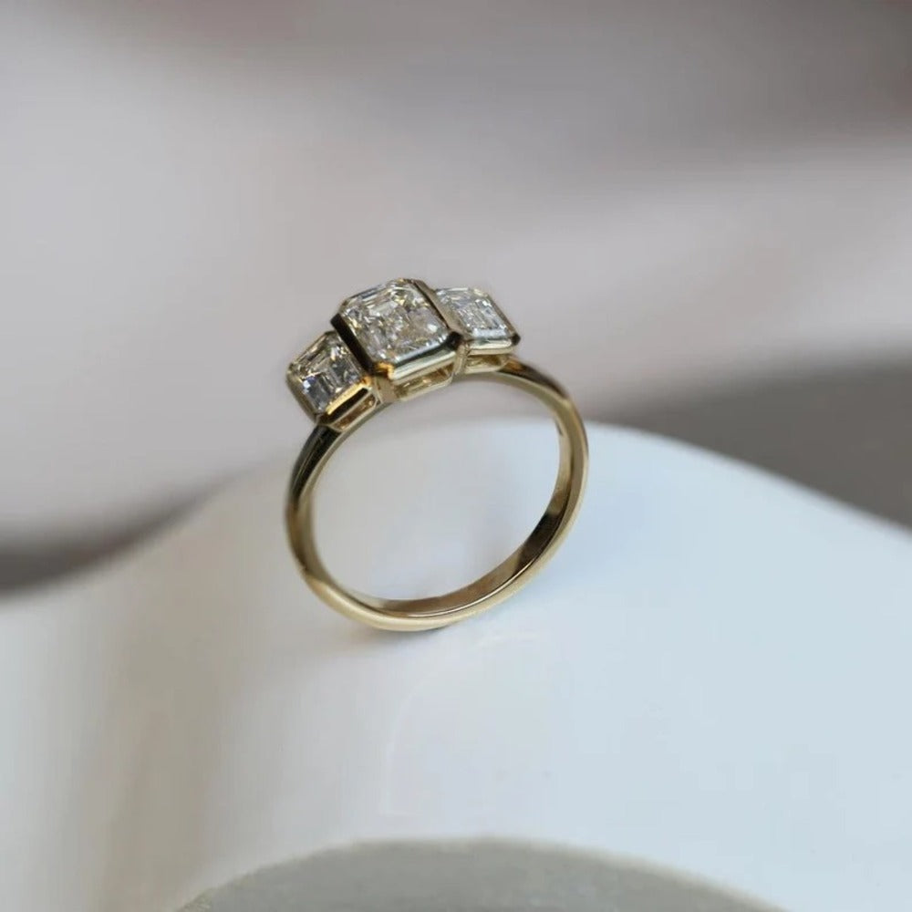 Emerald Three Stone Moissanite Ring
